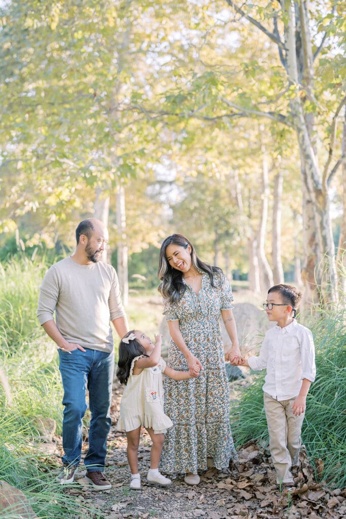 family laughing together during outdoor photoshoot location in Irvine