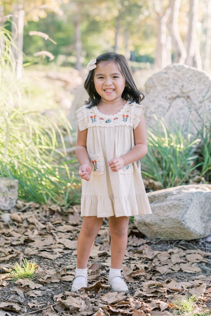 little girl laughing in park in Irvine